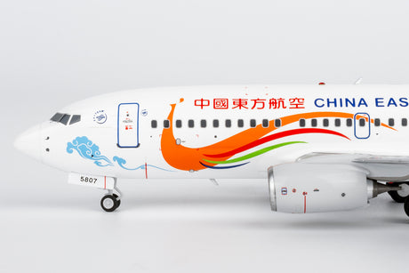 NG Models China Eastern Airlines Yunnan Peacock (orange) Boeing 737-700/w B-5807 1/200 Scale