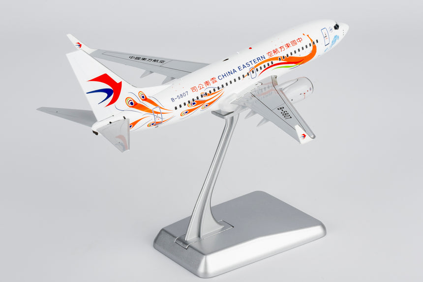 NG Models China Eastern Airlines Yunnan Peacock (orange) Boeing 737-700/w B-5807 1/200 Scale